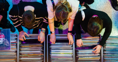 People picking out vinyl records during music fair organized by AGATA